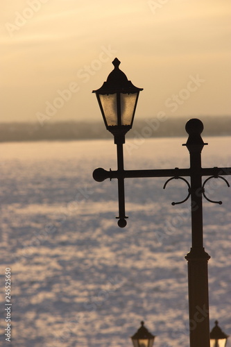old street lamp on the background of blue sky