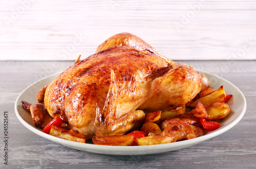 Baked chicken with vegetables on plate
