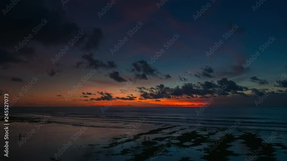 Timelapse of sunset and clouds reflected in waves of sea. Timelapse of sunset and clouds reflected in waves of sea.