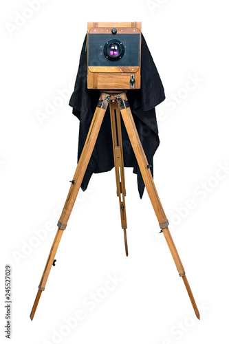 Fotografia old wooden camera on a tripod isolated on white background