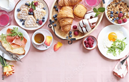 
    Brunch. Festive family breakfast set for Valentines day, Mothers day or Easter. Pink background