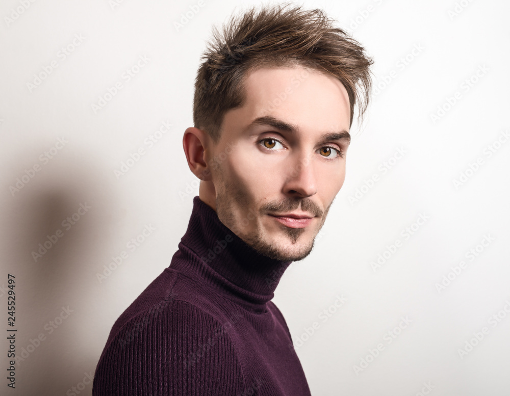 Handsome young elegant man in violet golf. Handsome young elegant man in violet golf.