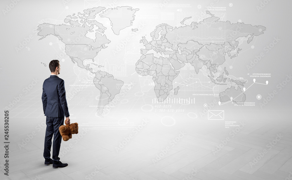 Businessman standing with his back and looking at a worldwide map with objects in his hand
Businessman standing with his back and looking at a worldwide map with objects in his hand