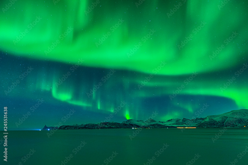 The sky of Norway wrapped by a cloud of aurora borealis