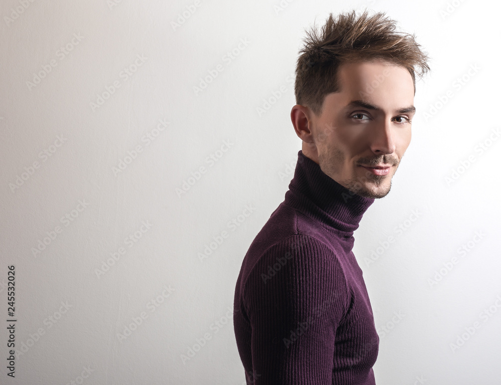Fototapeta premium Handsome young elegant man in violet golf.