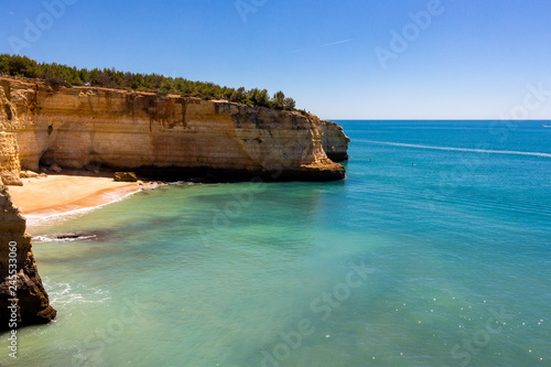 Beautiful view over cliffs, beach and turquoise ocean in Benagil beach (Praia de Benagil), Algarve, Portugal