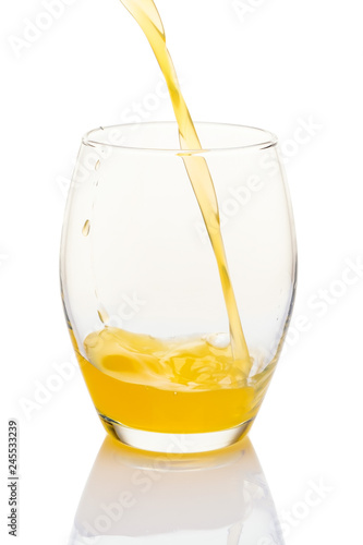 Single glass of orange juice on white background