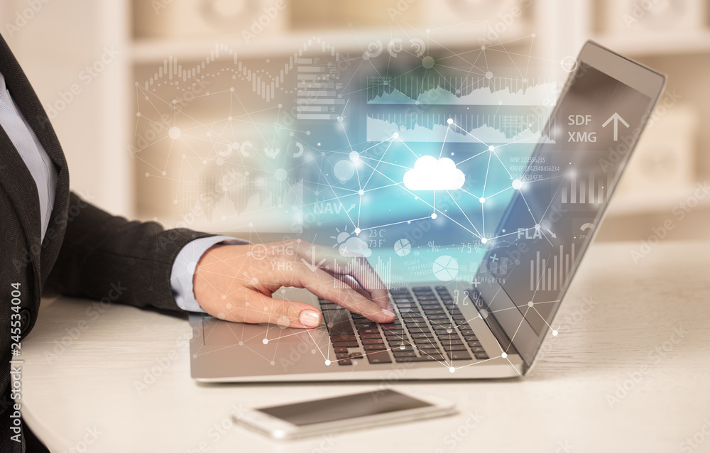 Business woman in homey environment using laptop with cloud technology concept
Business woman in homey environment using laptop with cloud technology concept