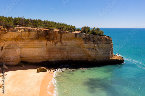 Beautiful view over cliffs, beach and turquoise ocean in Benagil beach (Praia de Benagil), Algarve, Portugal