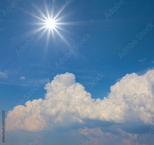 natural background  sparkle sun above a cumulus clouds