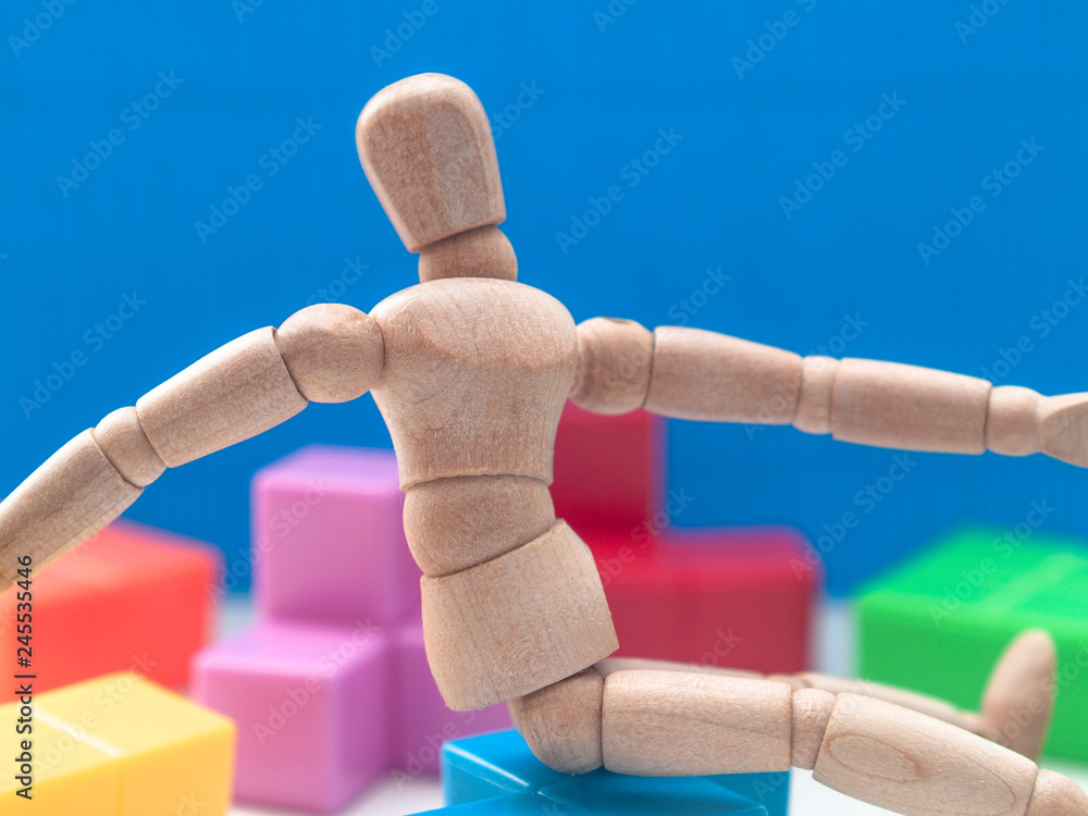 hand with building blocks on blue background hand with building blocks on blue background