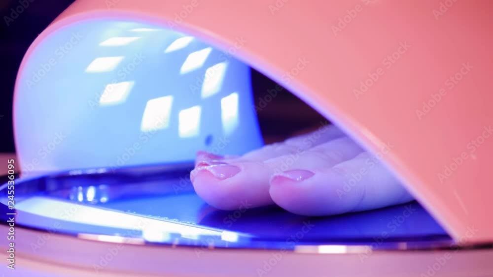 UV lamp gel polish manicure process in home conditions. UV lamp gel polish manicure process in home conditions.