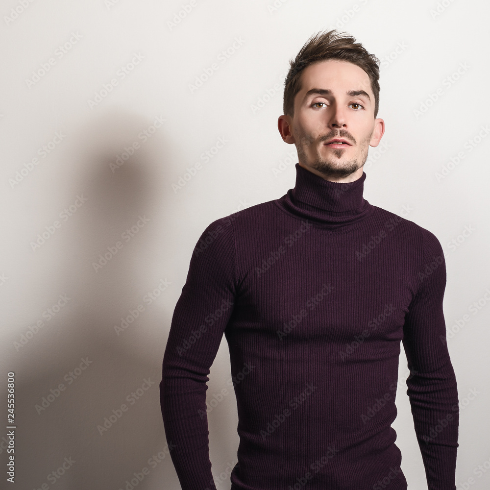 Fototapeta premium Handsome young elegant man in violet golf.