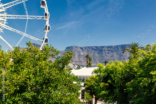Ferris wheel and Table Mountain view at Waterfront in Cape Town