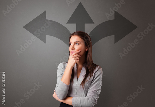 Business person choosing between two directions photo
