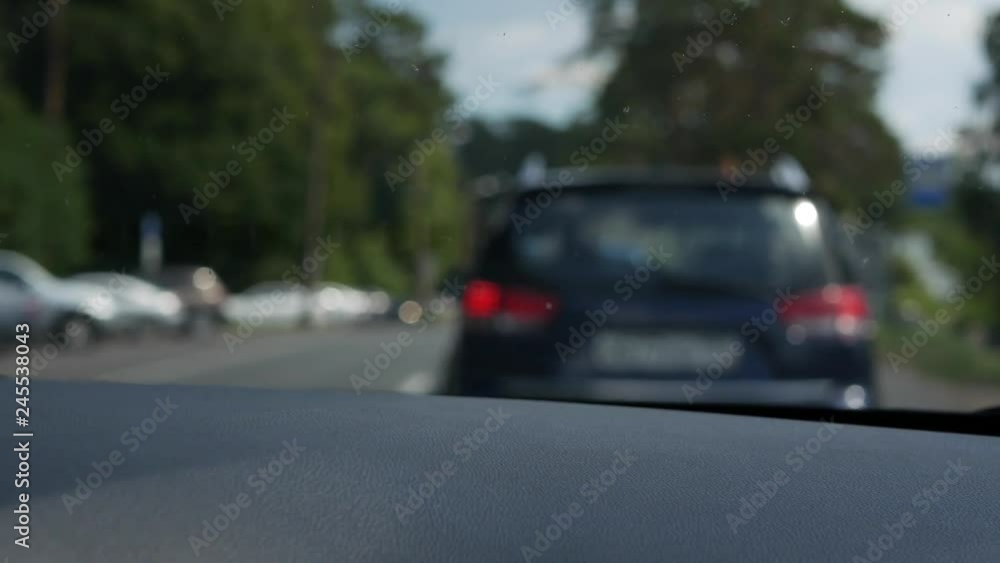 Blurred view through the front window of the car. The car goes on a country road. 4K Blurred view through the front window of the car. The car goes on a country road. 4K