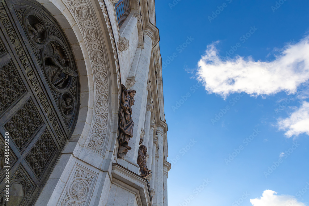 Closeup view of Cathedral of Christ the Saviour facade in Moscow with blue sky background