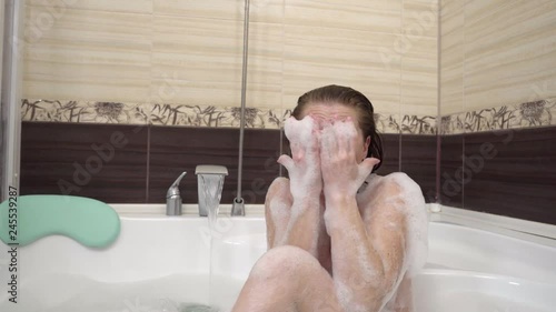 woman sitting in bath feels horror when sees rapist.
 photo