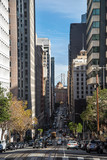 Vertical view of historic traditional Cable Cars riding on famous California Street, San Francisco