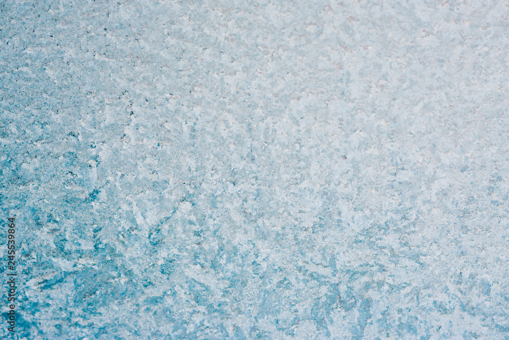 Frozen winter abstract background on the window glass with copy space Frozen winter abstract background on the window glass with copy space