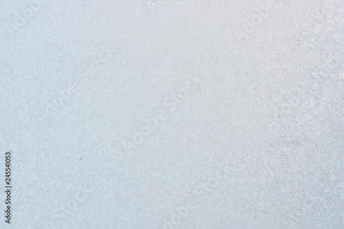 Winter background with gleaming ice. Frozen water texture. Copy space