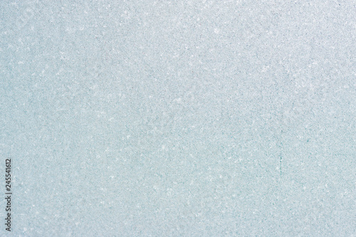 Ice background, frozen water with glass. Winter texture. Copy space.