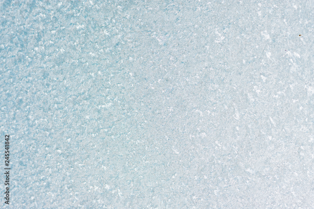 Fototapeta premium Frozen winter abstract background on the window glass with copy space