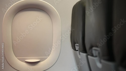 4K Hand of asian man close airplane window from seat.