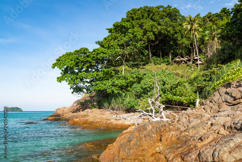 Lonely Beach  Koh Chang Island  clear waters washing the rocky shore.