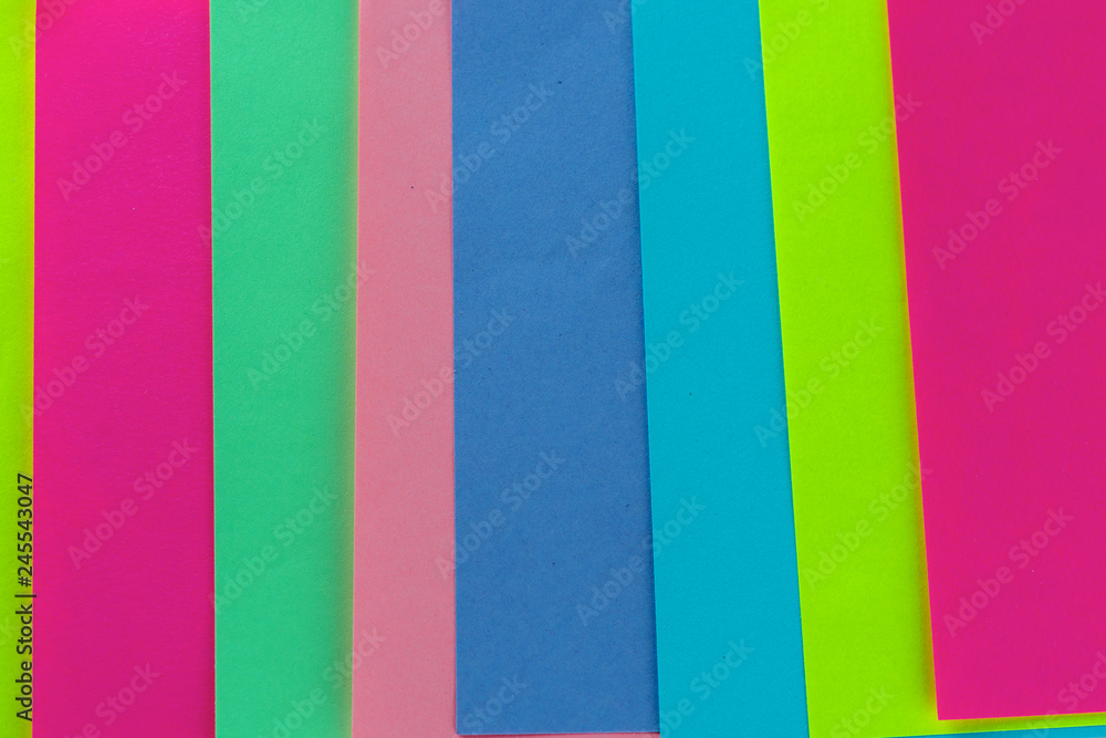 Blue,pink,yellow,purple,green neon paper color for background. Striped geometric pattern of bright colors. Blue,pink,yellow,purple,green neon paper color for background. Striped geometric pattern of bright colors.