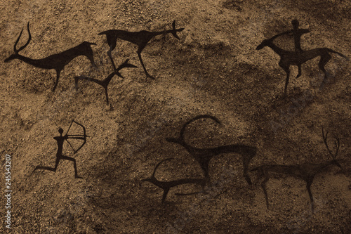 image of ancient hunting on the cave wall. history of antiquities, archeology.