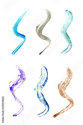 Eyeliner brush stroke samples with glitter, isolated on white background
