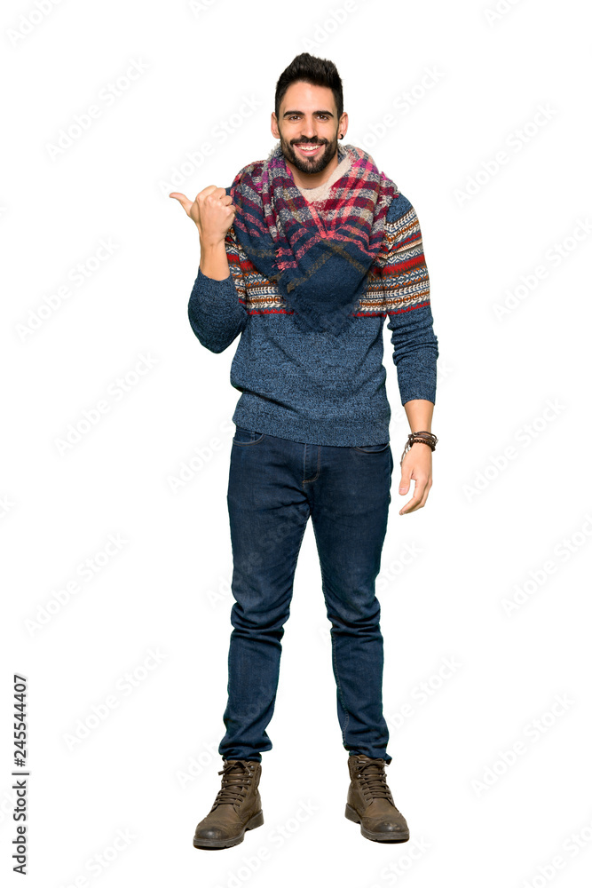 Full-length shot of Hippie man pointing to the side to present a product on isolated white background Full-length shot of Hippie man pointing to the side to present a product on isolated white background