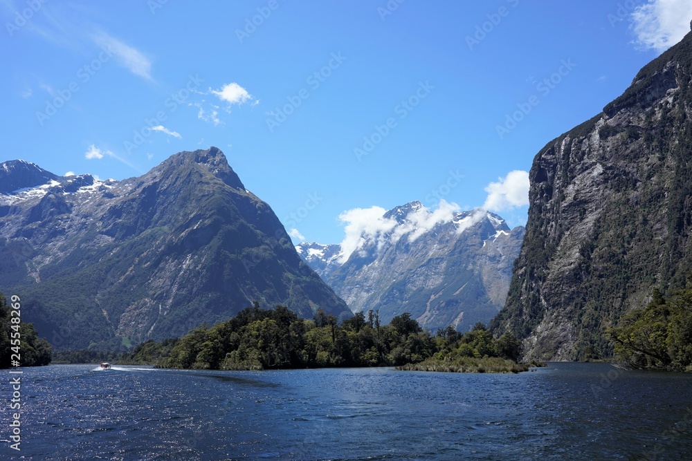 Blue lake in the mountains, the end point of the Milford Track, New Zealand South Island Blue lake in the mountains, the end point of the Milford Track, New Zealand South Island