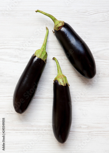 Fresh raw eggplant, overhead view. Top view, flat lay, from above.