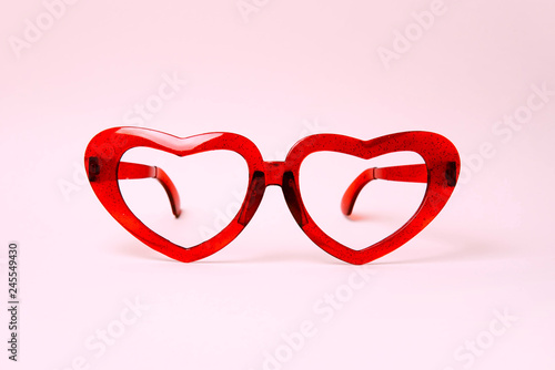 A pair of red heart shaped sun glasses.