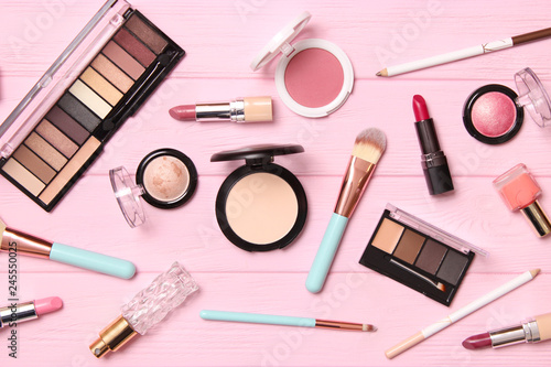  professional makeup tools. Makeup products on wooden background top view. A set of various items for makeup.