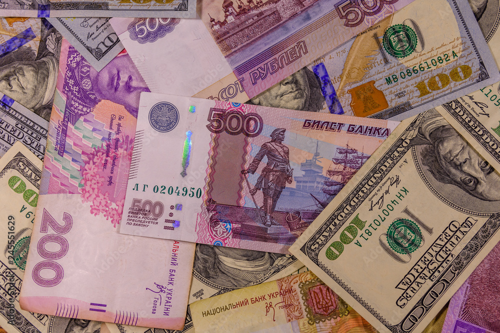 Background of the different american, ukrainian and russian banknotes Background of the different american, ukrainian and russian banknotes