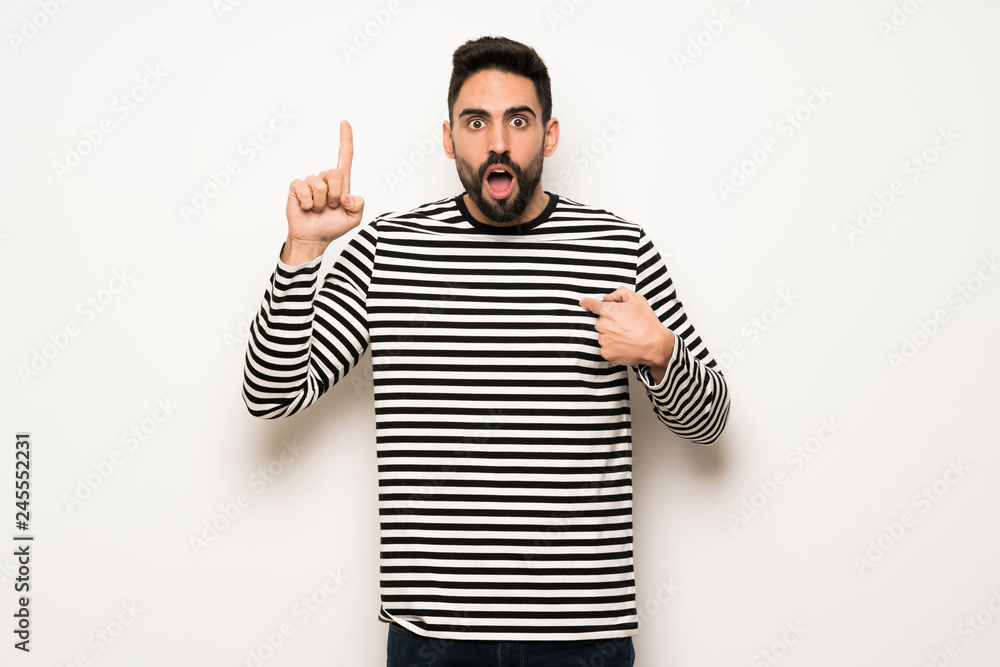 Naklejka premium handsome man with striped shirt with surprise facial expression