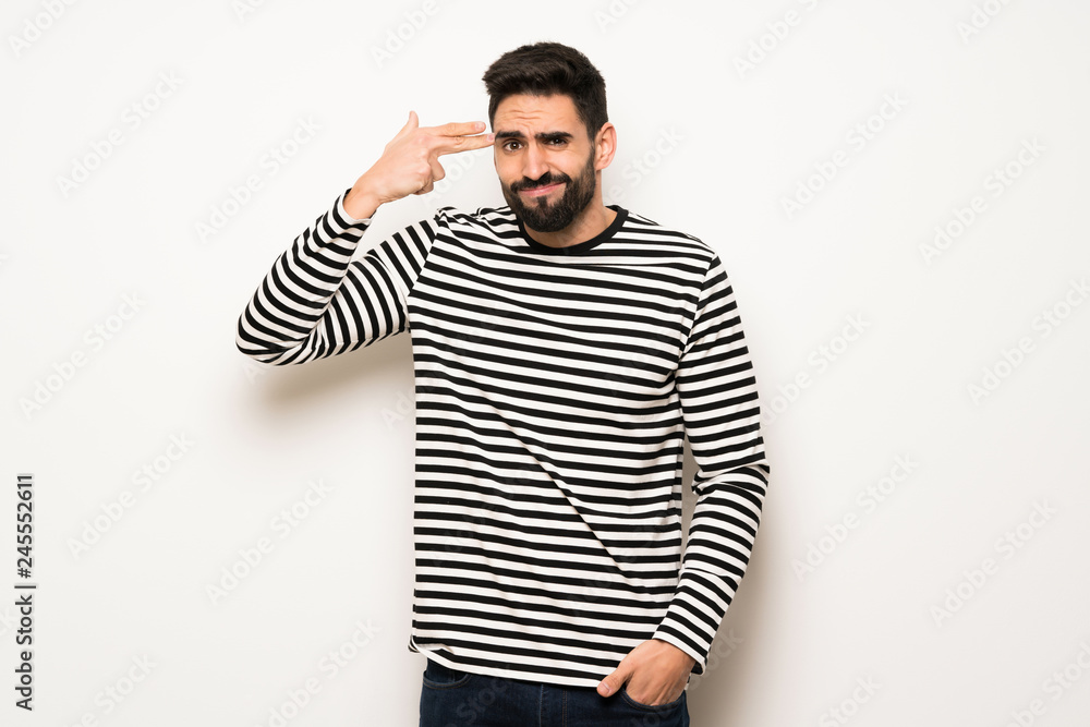 Fototapeta premium handsome man with striped shirt with problems making suicide gesture
