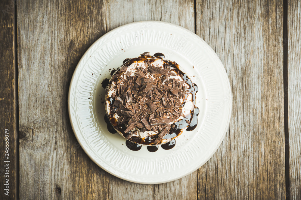 Fresh chocolate cake on the dark rustic background. Selective focus. Fresh chocolate cake on the dark rustic background. Selective focus.