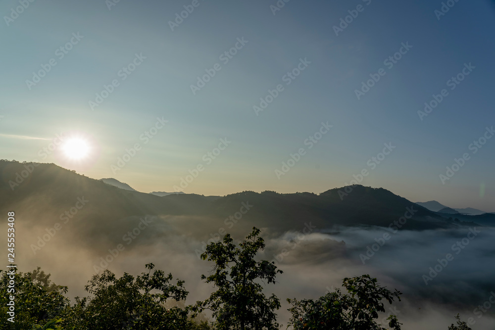In the morning, the sun, the high mountains, the fog and the beautiful sky. In the morning, the sun, the high mountains, the fog and the beautiful sky.