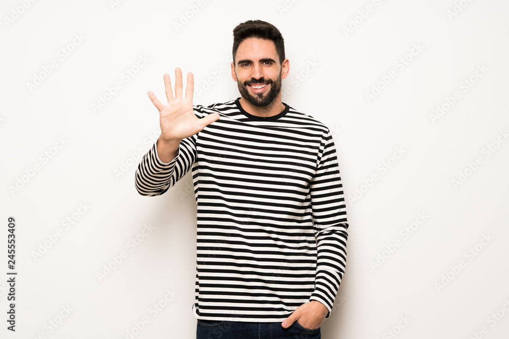 handsome man with striped shirt counting five with fingers handsome man with striped shirt counting five with fingers