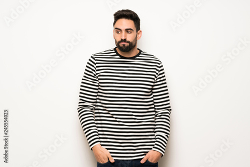 handsome man with striped shirt feeling upset