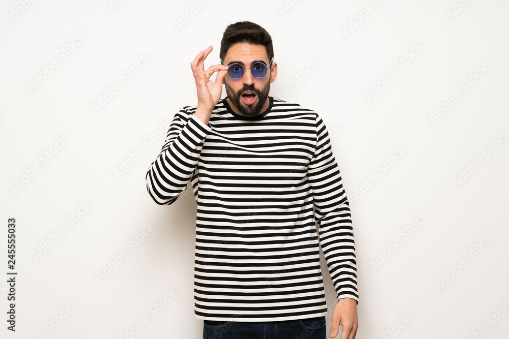 Obraz premium handsome man with striped shirt with glasses and surprised