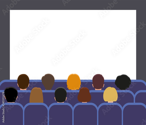 Man and women watching a movie. Back view. People in the movie theater or movie screening room.