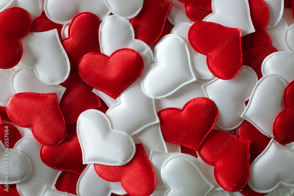 Red and white textile hearts closeup. Valentines day background, creative texture and love concept