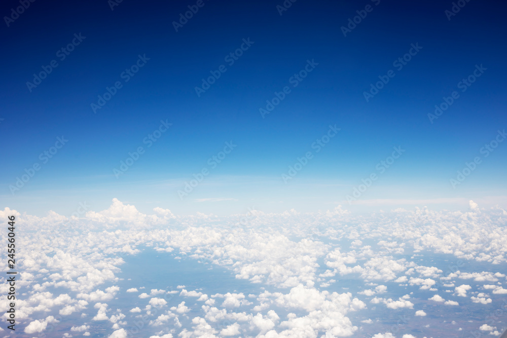 Blue sky background and white clouds soft focus, top view and copy space