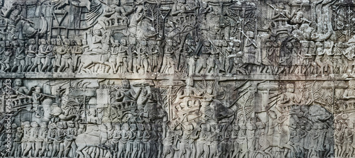 Bas-relief at Bayon temple in Angkor Thom. Siem Reap. Cambodia. Panorama