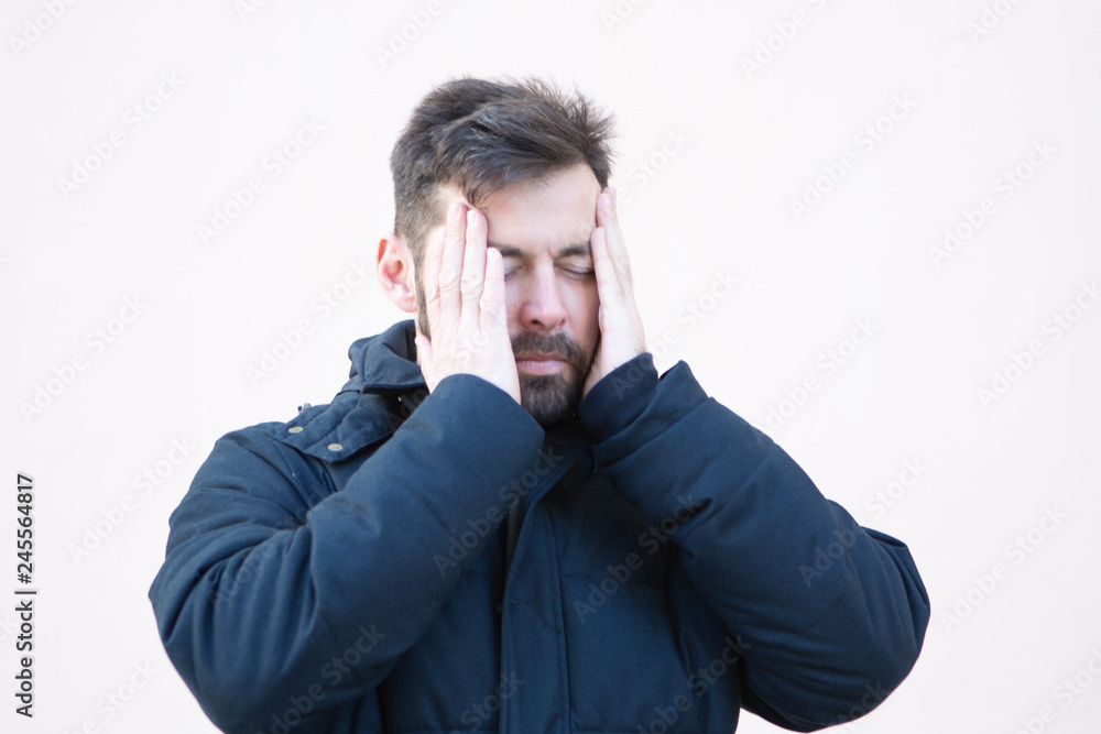 man in winter with headache man in winter with headache